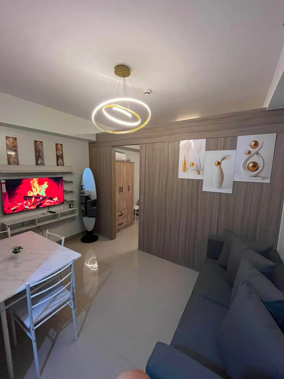Living area with a sofa facing the smart TV