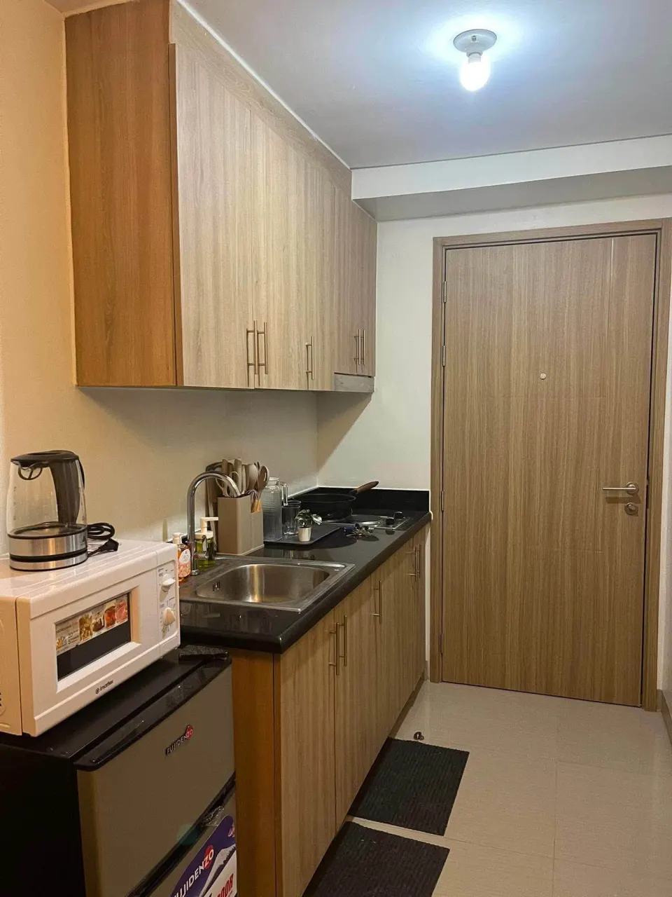Kitchen cabinets and the entrance door