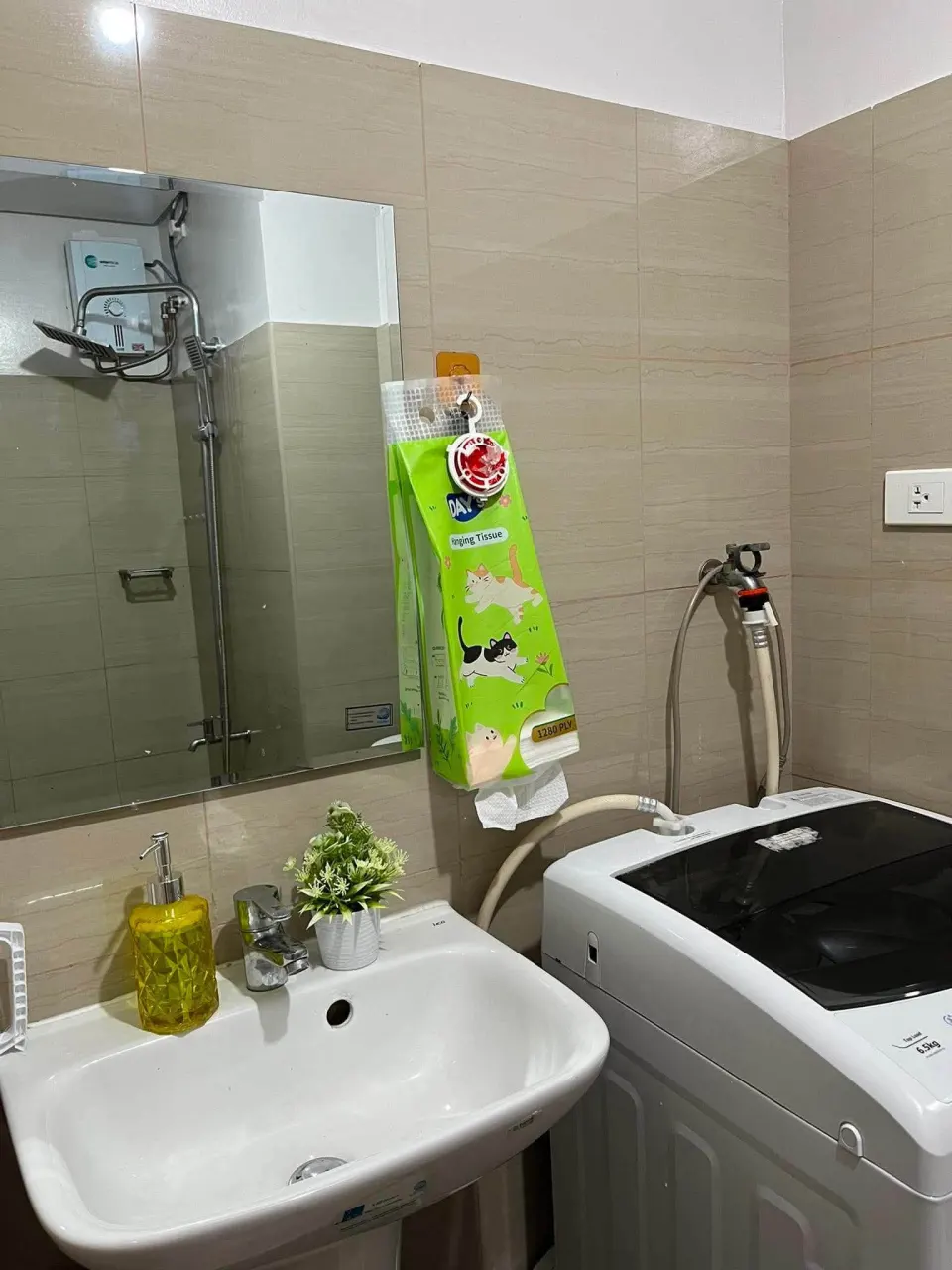 Bathroom sink beside the washing machine